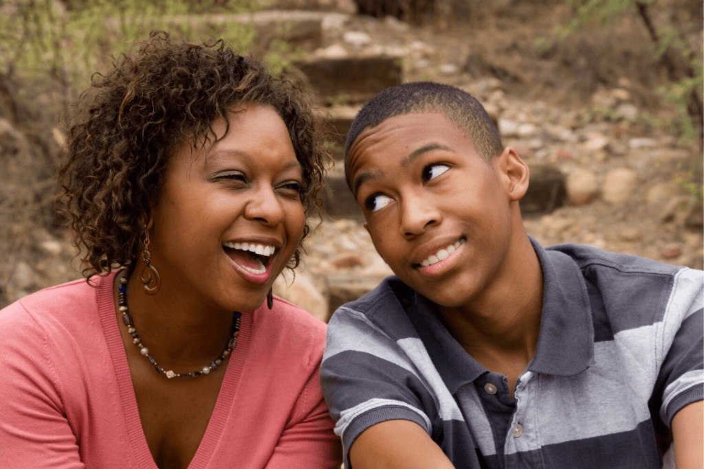 Close up of a mother and son laughing and smiling