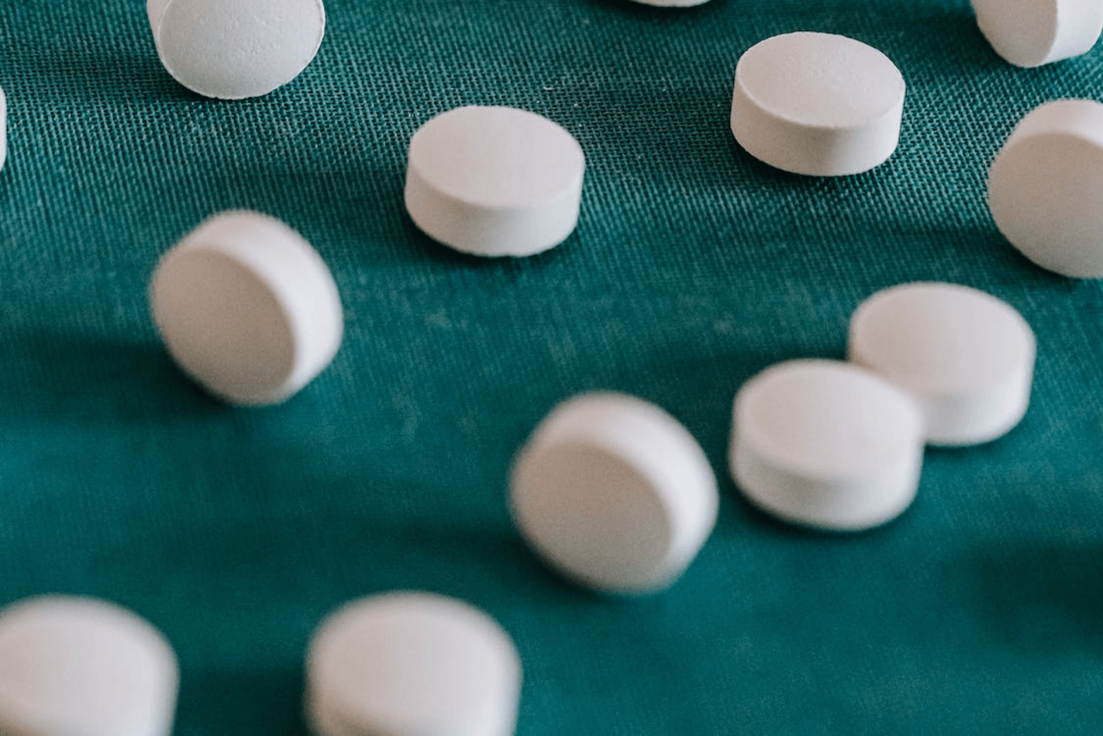 White pills on a table.