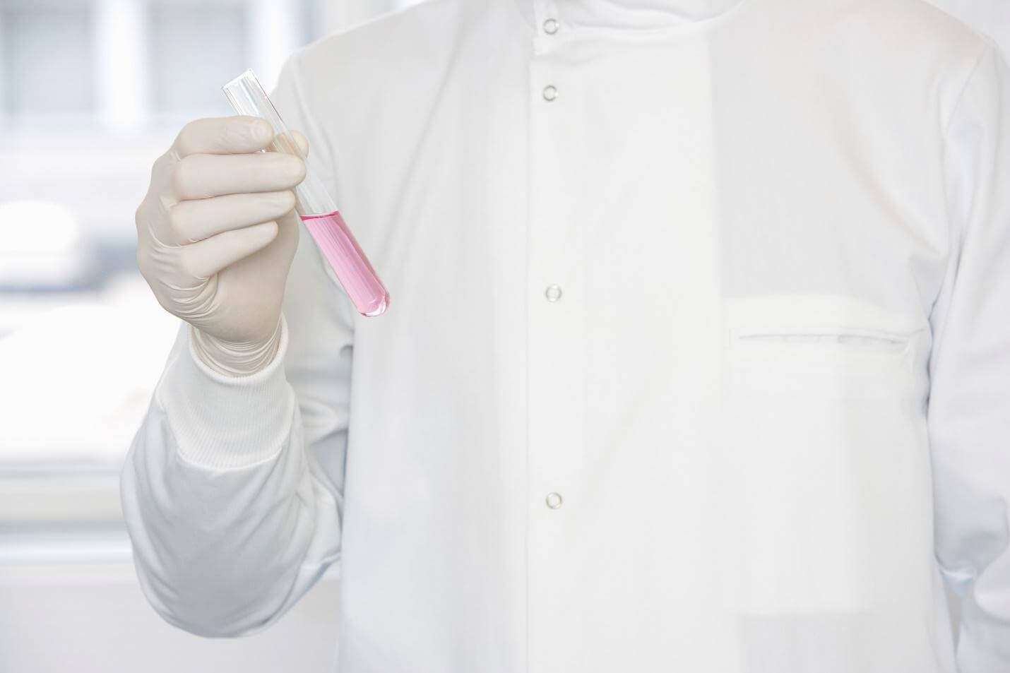 Close up of a doctor holding a test tube
