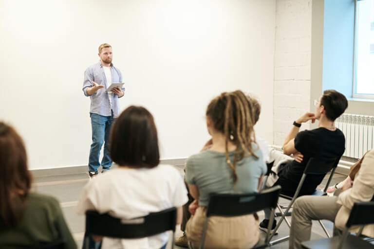 A man speaks to a community support group