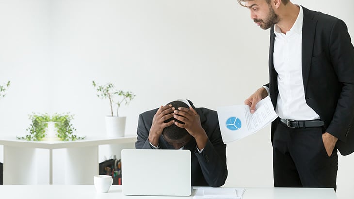 An employer upset with an employee at work
