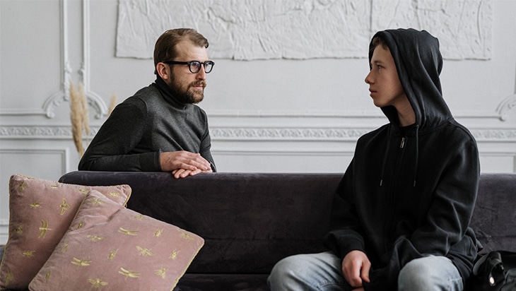 A father talking to his son about peer pressure