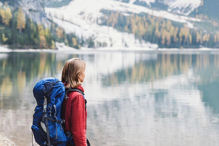 A woman travels to a lake in the Alps to celebrate her addiction recovery