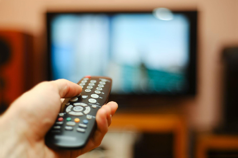 Close-up of the remote as someone watches mental health documentaries