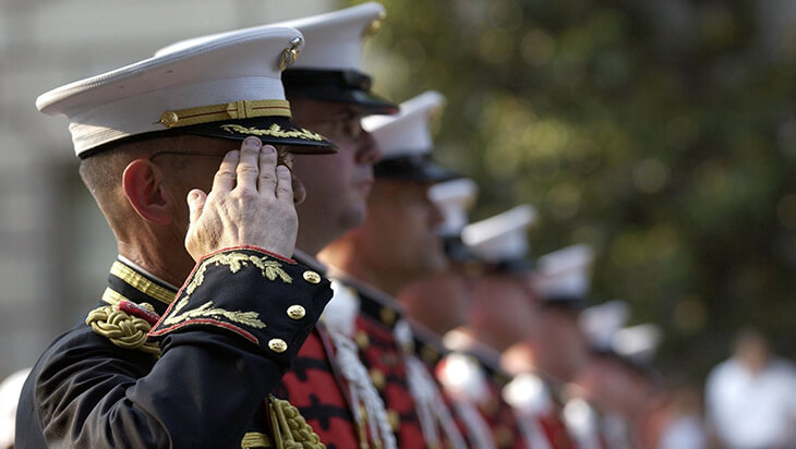 A captain saluting during a Veteran’s Day ceremony