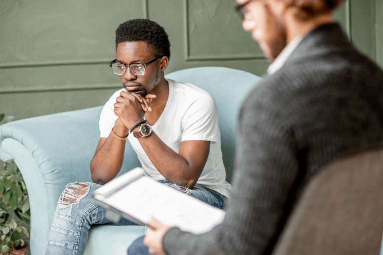 a man in a therapy session with a psychologist 