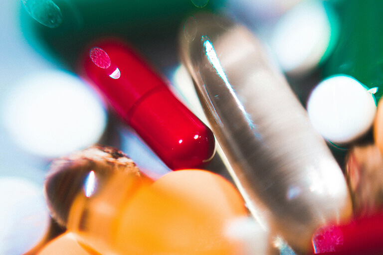 A close-up of a few mismatched pills